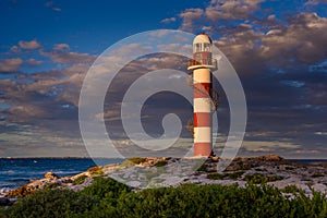 Lighthouse at sunset in twilight in clear weather