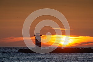 Lighthouse at sunset in Wijk aan Zee. The Netherlands