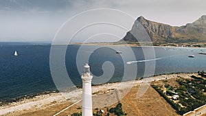 Lighthouse tower in front of bay