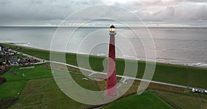 Lighthouse tower Lange Jaap in Den Helder drone aerial footage 5K along the sea near the island of Texel in North