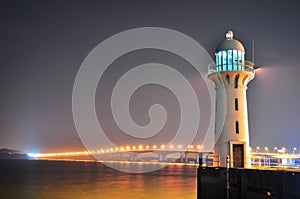 A lighthouse in Tuas Second link by night photo