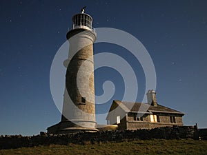 Lighthouse under a starry night sky. Lundy Island, Devon