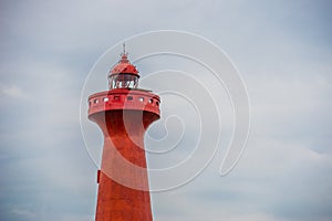 Lighthouse under sunburst