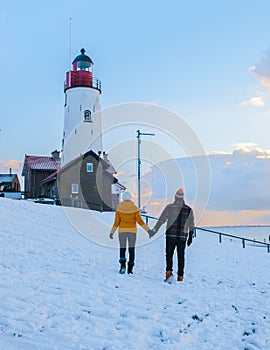 Lighthouse of Urk during winter with snow in the Netherlands