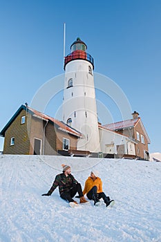 Lighthouse of Urk during winter with snow in the Netherlands