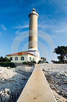 The lighthouse at Veli Rat, on the island Dugi Otok, Adriatic sea, Croatia, popular sailing destination, view from the pier