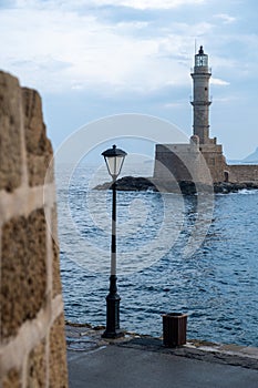 Lighthouse at Venetian harbor, Old Town of Chania Crete, Greece. View from Firkas Fortress. Vertical