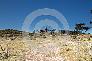 Lighthouse of Vlieland on the dunes in the Netherlands photo