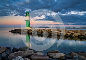 Lighthouse WarnemÃÂ¼nde at sunrise photo