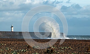 Lighthouse and Waves at Newhaven photo