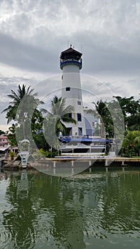 Lighthouse with white cloud