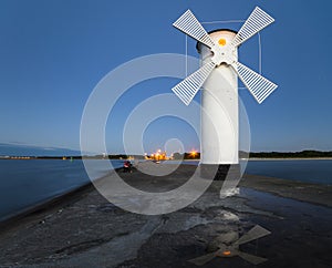 Lighthouse windmill Swinoujscie, Baltic Sea, Poland photo