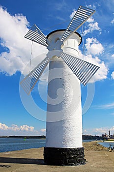 Lighthouse windmill in Swinoujscie, Poland photo
