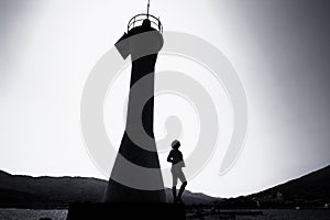 Lighthouse and a woman