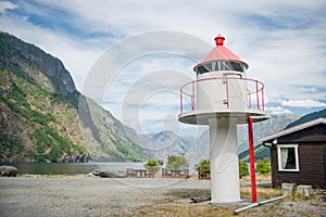 lighthouse and wooden building in beautiful mountains at Aurlandsfjord Flam