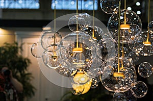 Lighting balls on the chandelier in the lamplight, light bulbs hanging from the ceiling