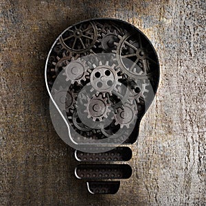 Lighting bulb business concept with working gears and cogs