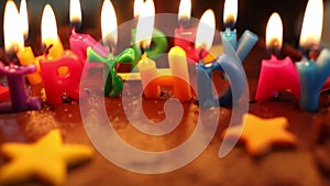Lighting candles on a chocolate birthday cake video footage