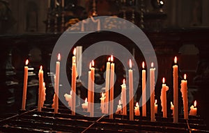 Lighting candles in a church