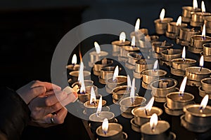 Lighting candles in a church