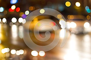 Lighting cars on defocused in the street at night for background