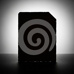 Lighting creates a strong contrast, emphasizing the shape with sharp edges