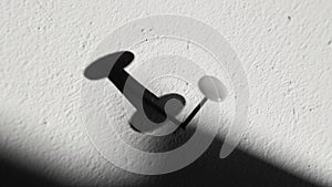 The lighting emphasizes the grain of the wall, adding depth to the image