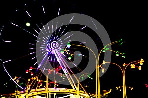 Lighting Ferris wheel at night in famous Prater theme amusement Park