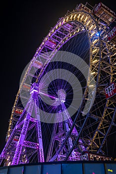Lighting Ferris wheel at night in Prater Park in Vienna