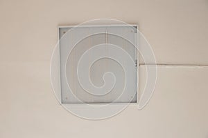 Lighting fixture hangs on the ceiling on a light