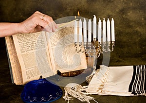 Lighting hanukkah candles photo