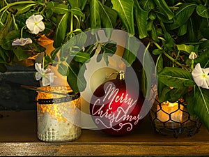 Lighting of a lantern with candles in natural Christmas decoration