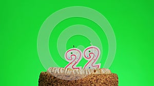 Lighting a number four birthday candle on a delicious cake, green screen 22