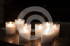 Lighting Prayer Candles in a Church