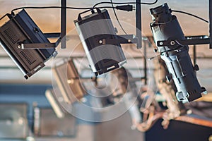 Lighting spotlights on the stage of the theater