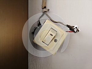 The lighting switch dropped and hung out of the wall. power on -off,