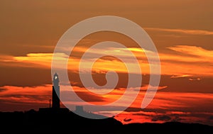 Lighting Trafalgar Lighthouse and sunset, Spain photo