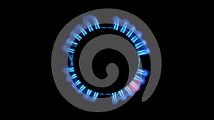 Lighting up blue gas in a gas stove top view, on a black background. Slow motion.