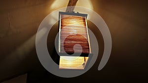 Lighting wooden chandelier in cozy interior close up