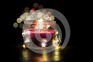 Lightining candle on dark background photo
