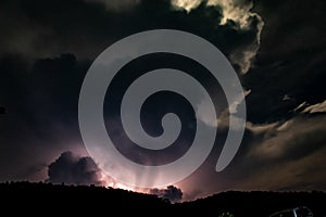 Lightning Behind the Mountain at night
