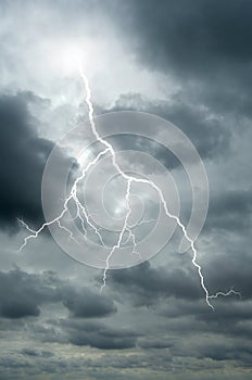 Lightning bolt flashes through a dramatic sky