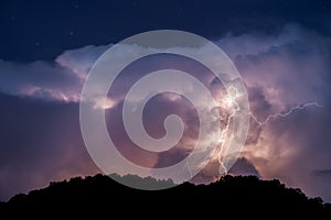 Lightning bolt and night sky during passing storm