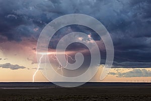 Lightning strike from a thunderstorm at sunset