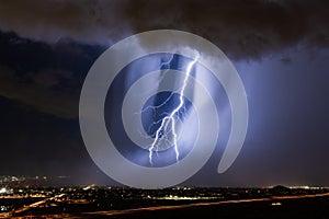 Lightning bolt striking through a microburst in a storm