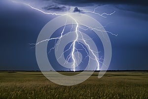 Lightning bolt strikes through sky over open field, dramatic energy