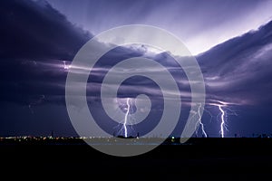 Lightning bolts from an approaching thunderstorm