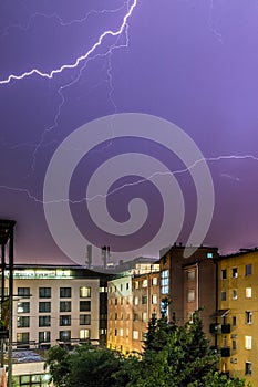 Lightning on the cloudy sky, urban city life with buildings, Austria