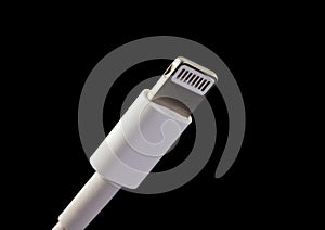 Lightning connector isolated on black background. Device charger male plug.