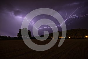 Lightning at night at Espejo, Alava, Spain photo